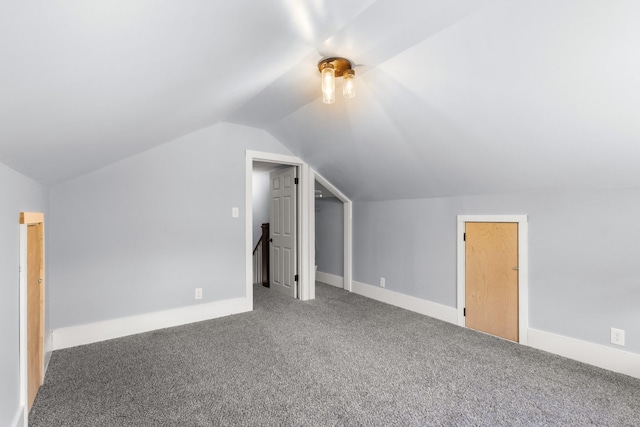 bonus room featuring carpet and vaulted ceiling