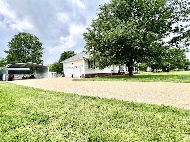 exterior space with concrete driveway, a detached carport, and a garage