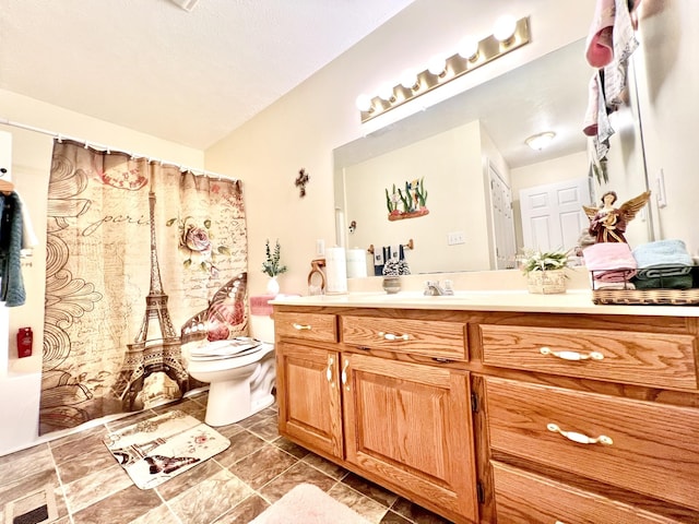 bathroom with toilet, curtained shower, and vanity