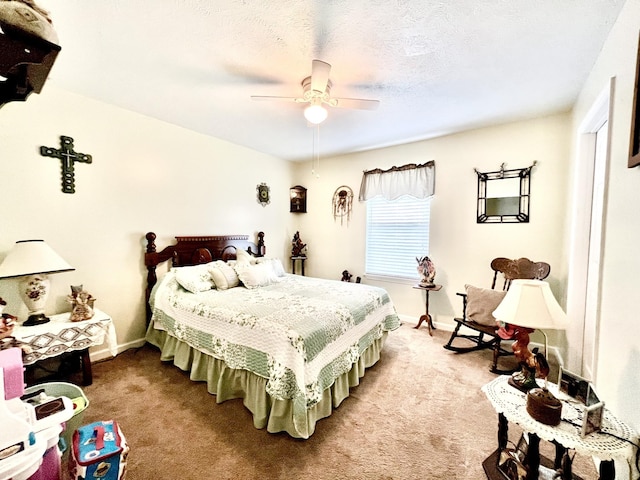 carpeted bedroom featuring baseboards and a ceiling fan