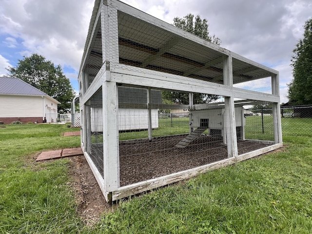 exterior space featuring fence and exterior structure