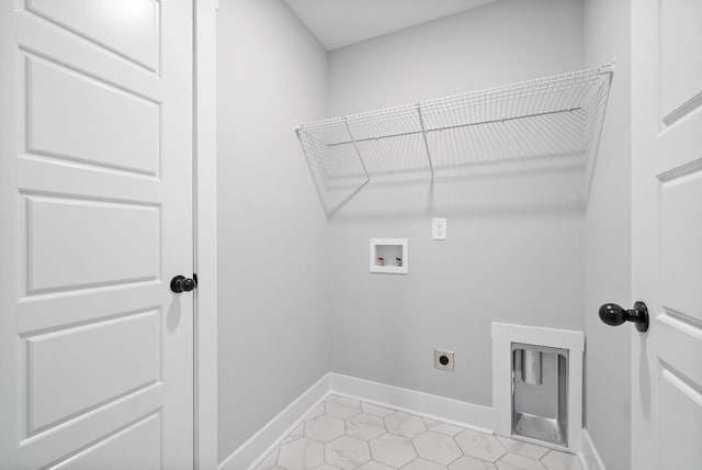 laundry area with hookup for a washing machine, laundry area, hookup for an electric dryer, baseboards, and light tile patterned flooring
