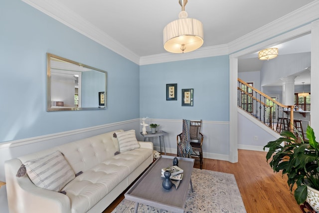 1004 Sattui Ct, Franklin, TN 37064 - living room featuring wood finished floors, decorative columns, stairway, baseboards, and ornamental molding