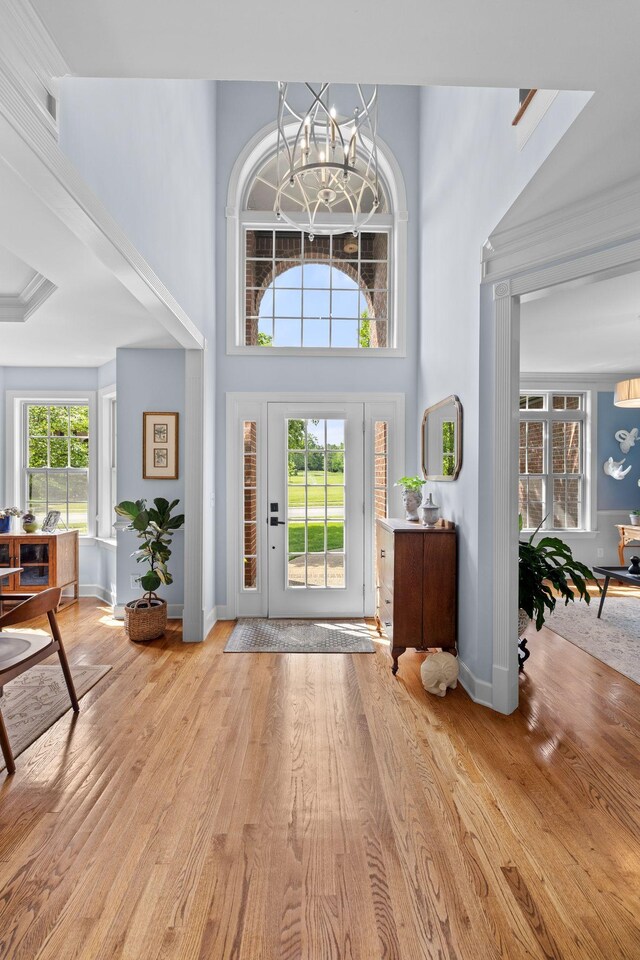 1004 Sattui Ct, Franklin, TN 37064 - foyer entrance with an inviting chandelier, a high ceiling, baseboards, and light wood finished floors