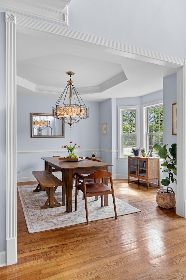 1004 Sattui Ct, Franklin, TN 37064 - dining area with baseboards, a tray ceiling, light wood-type flooring, and a chandelier