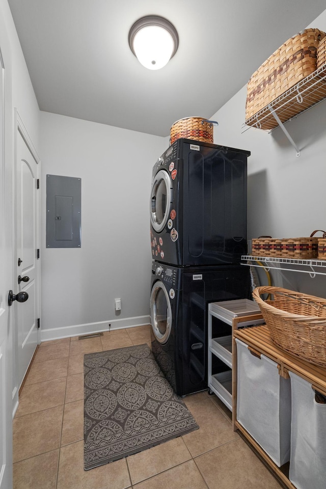 1004 Sattui Ct, Franklin, TN 37064 - washroom with stacked washer and clothes dryer, electric panel, tile patterned floors, and baseboards