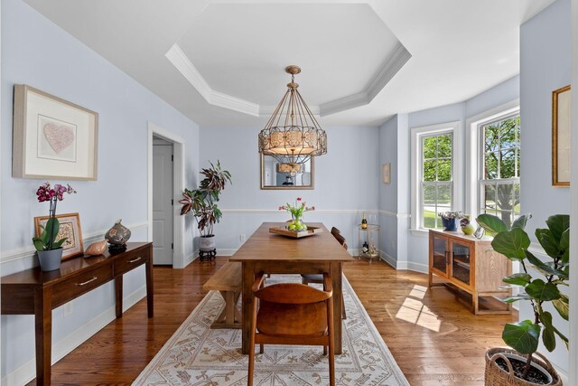 1004 Sattui Ct, Franklin, TN 37064 - dining space with wood finished floors, baseboards, crown molding, a raised ceiling, and a notable chandelier