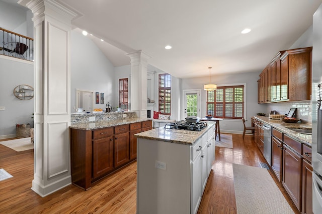 1004 Sattui Ct, Franklin, TN 37064 - kitchen with decorative columns, light wood-type flooring, dishwasher, a center island, and baseboards