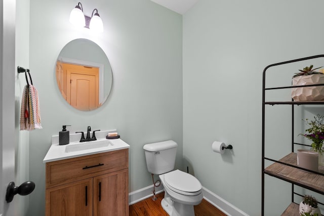 1004 Sattui Ct, Franklin, TN 37064 - bathroom featuring wood finished floors, toilet, vanity, and baseboards
