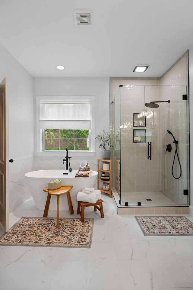 1004 Sattui Ct, Franklin, TN 37064 - full bath with a stall shower, visible vents, a freestanding tub, marble finish floor, and recessed lighting