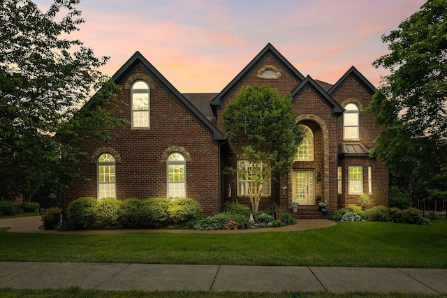 1004 Sattui Ct, Franklin, TN 37064 - french country home with brick siding and a yard