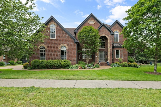 1004 Sattui Ct, Franklin, TN 37064 - traditional home with brick siding and a front lawn