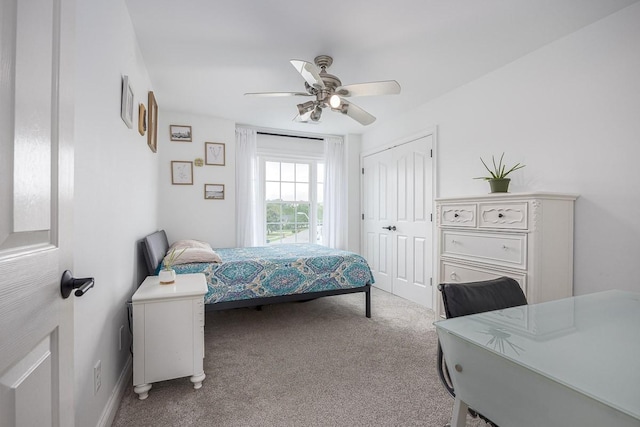 bedroom featuring a closet, a ceiling fan, and carpet flooring