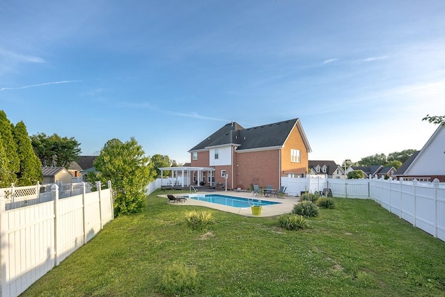 view of pool with a fenced in pool, a fenced backyard, a patio area, and a yard