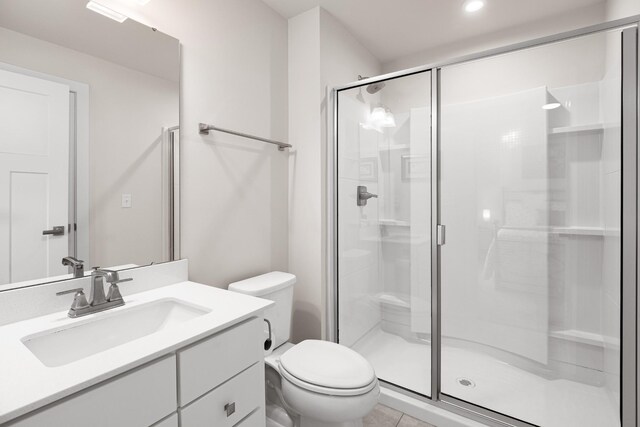 full bath with recessed lighting, vanity, a shower stall, and toilet