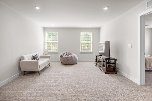 living area featuring carpet floors, recessed lighting, baseboards, and visible vents