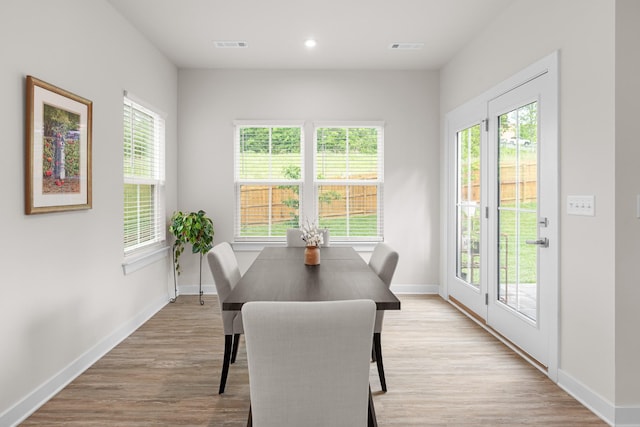 dining room with baseboards, recessed lighting, light wood-style floors, and visible vents