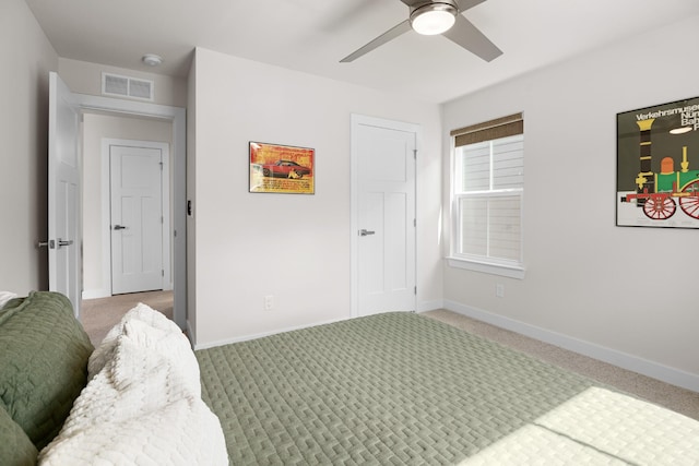 bedroom featuring carpet floors, ceiling fan, baseboards, and visible vents