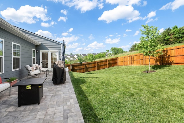 view of yard with a fenced backyard and a patio area