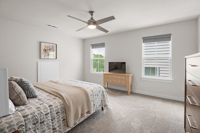 bedroom with carpet floors, baseboards, visible vents, and ceiling fan