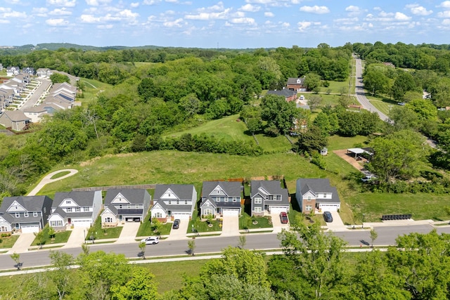 aerial view featuring a residential view and a forest view