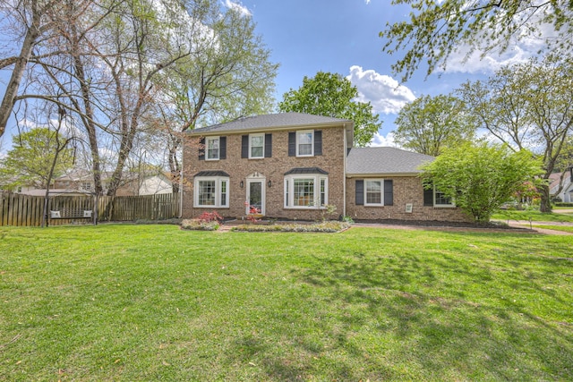 301 Jennette Pl, Franklin, TN 37064 - colonial house with a front lawn, brick siding, and fence