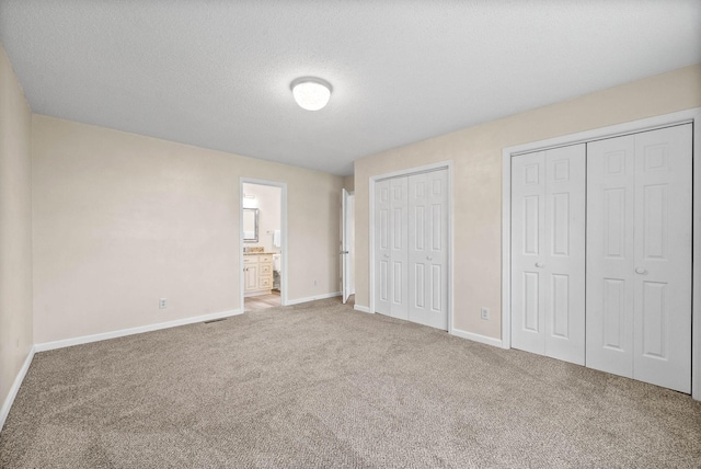 3844 Marla Cir, Clarksville, TN 37042 - unfurnished bedroom with carpet flooring, two closets, and baseboards