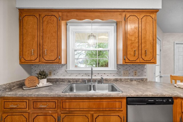 3844 Marla Cir, Clarksville, TN 37042 - kitchen with backsplash, dishwasher, brown cabinetry, and a sink