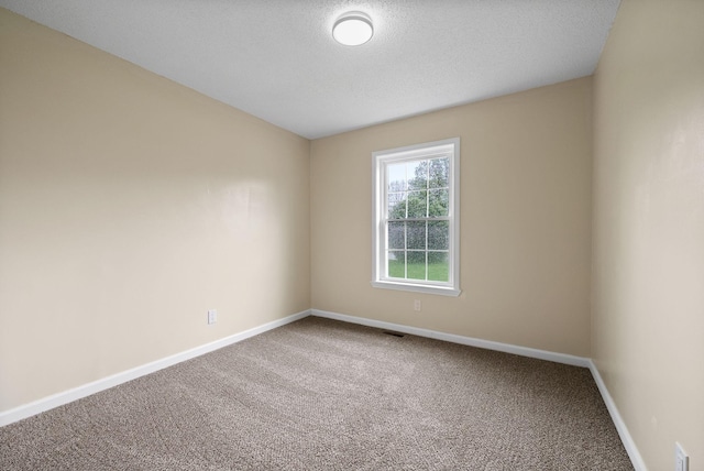 3844 Marla Cir, Clarksville, TN 37042 - empty room featuring a textured ceiling, visible vents, carpet flooring, and baseboards