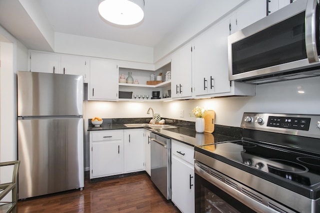 3901 Whitland Ave # 11, Nashville, TN 37205 - kitchen with white cabinets, dark countertops, appliances with stainless steel finishes, and a sink