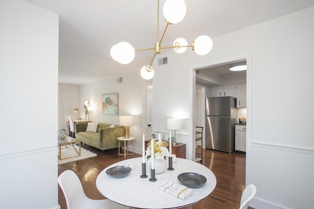 3901 Whitland Ave # 11, Nashville, TN 37205 - dining room featuring baseboards, visible vents, an inviting chandelier, and dark wood-type flooring
