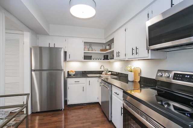 3901 Whitland Ave # 11, Nashville, TN 37205 - kitchen featuring open shelves, appliances with stainless steel finishes, dark countertops, a sink, and dark wood-type flooring