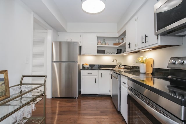 3901 Whitland Ave # 11, Nashville, TN 37205 - kitchen with dark wood-style floors, a sink, stainless steel appliances, open shelves, and dark countertops