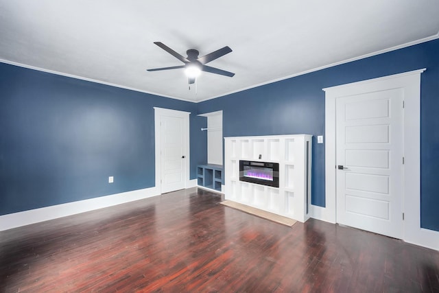 unfurnished living room featuring dark wood-style flooring, a glass covered fireplace, a ceiling fan, and baseboards