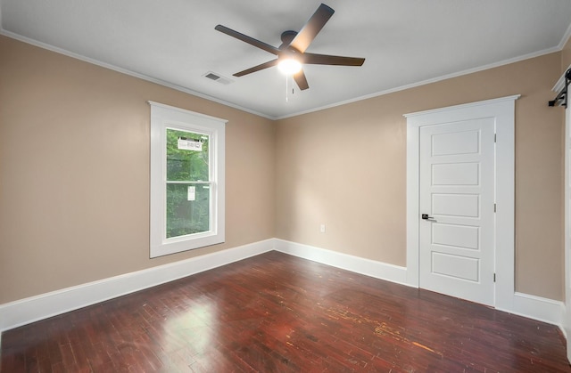 spare room with baseboards, visible vents, a ceiling fan, and dark wood-type flooring