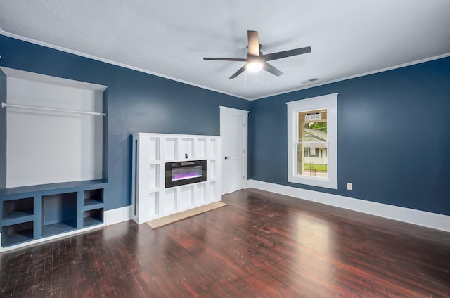 unfurnished living room with crown molding, visible vents, a glass covered fireplace, wood finished floors, and a ceiling fan