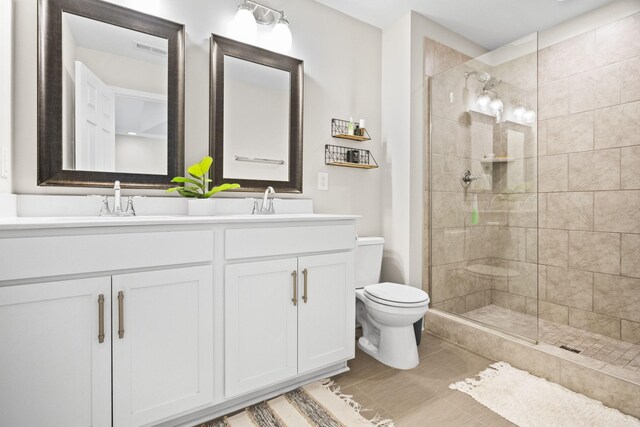123 Saddlewood Ln, Hendersonville, TN 37075 - bathroom with visible vents, double vanity, toilet, a sink, and a stall shower