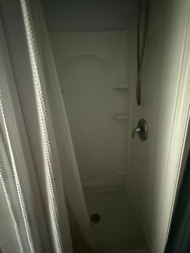 bathroom featuring a stall shower