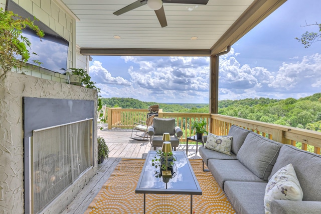 deck featuring outdoor lounge area and ceiling fan