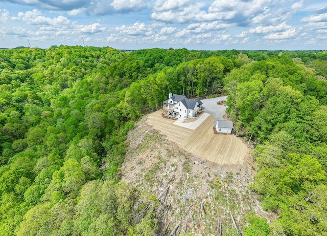 aerial view with a wooded view