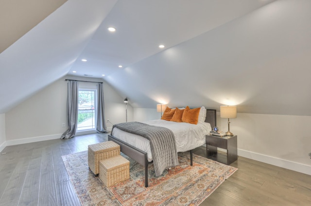 bedroom with baseboards, recessed lighting, wood finished floors, and lofted ceiling