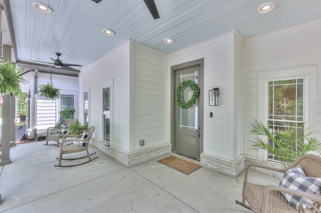 entrance to property with a ceiling fan