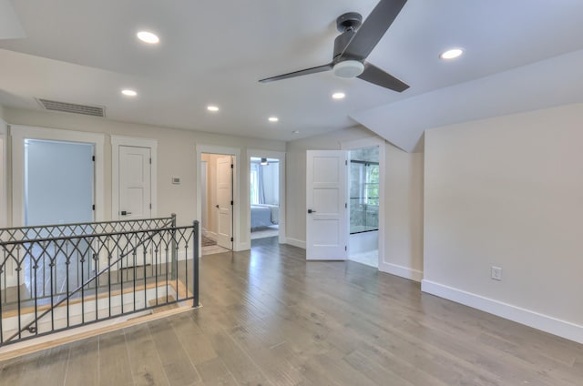 unfurnished room with recessed lighting, wood finished floors, baseboards, visible vents, and a ceiling fan