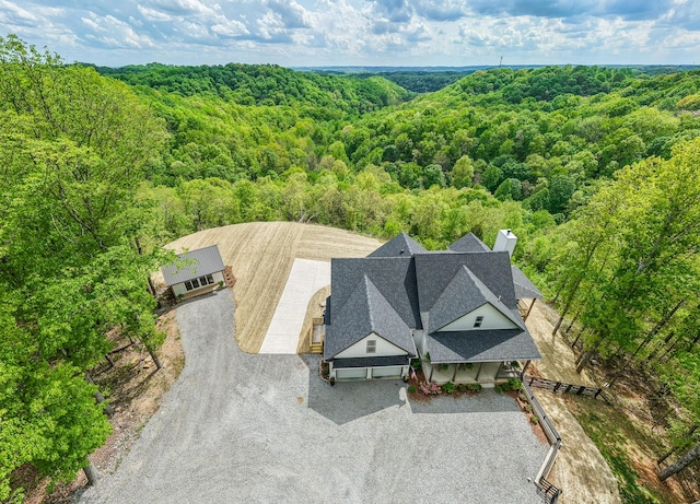 drone / aerial view with a forest view