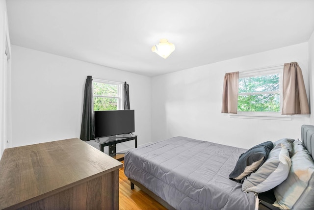 bedroom with light wood-style floors