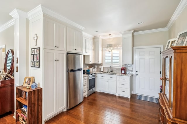 kitchen featuring appliances with stainless steel finishes, light stone countertops, dark wood finished floors, a sink, and white cabinetry