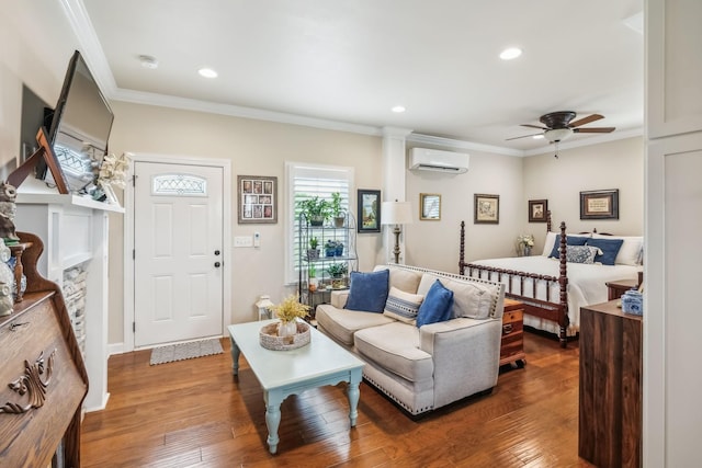living room featuring wood-type flooring, a ceiling fan, recessed lighting, a wall unit AC, and ornamental molding