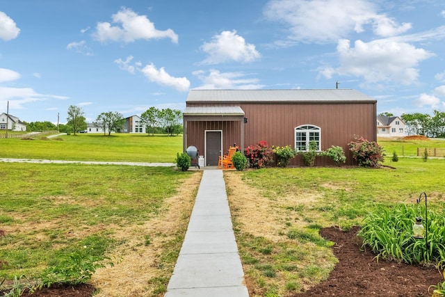 view of outbuilding featuring an outdoor structure and fence