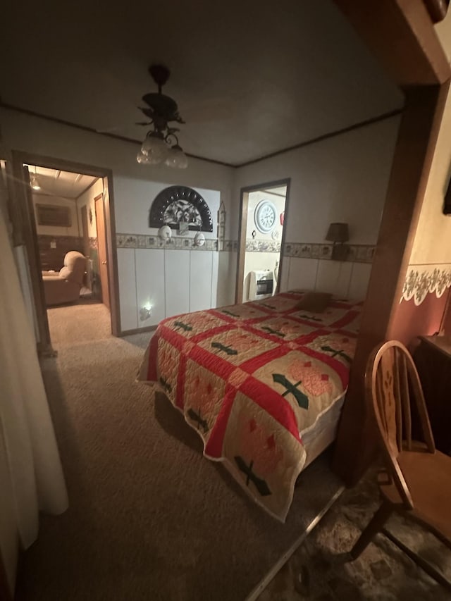 bedroom with ceiling fan and carpet