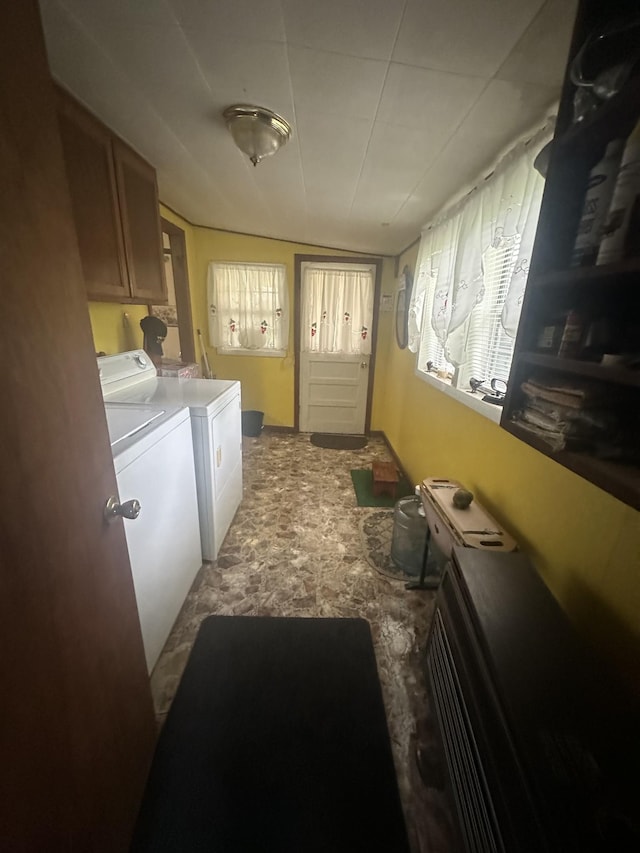 laundry room featuring washing machine and clothes dryer